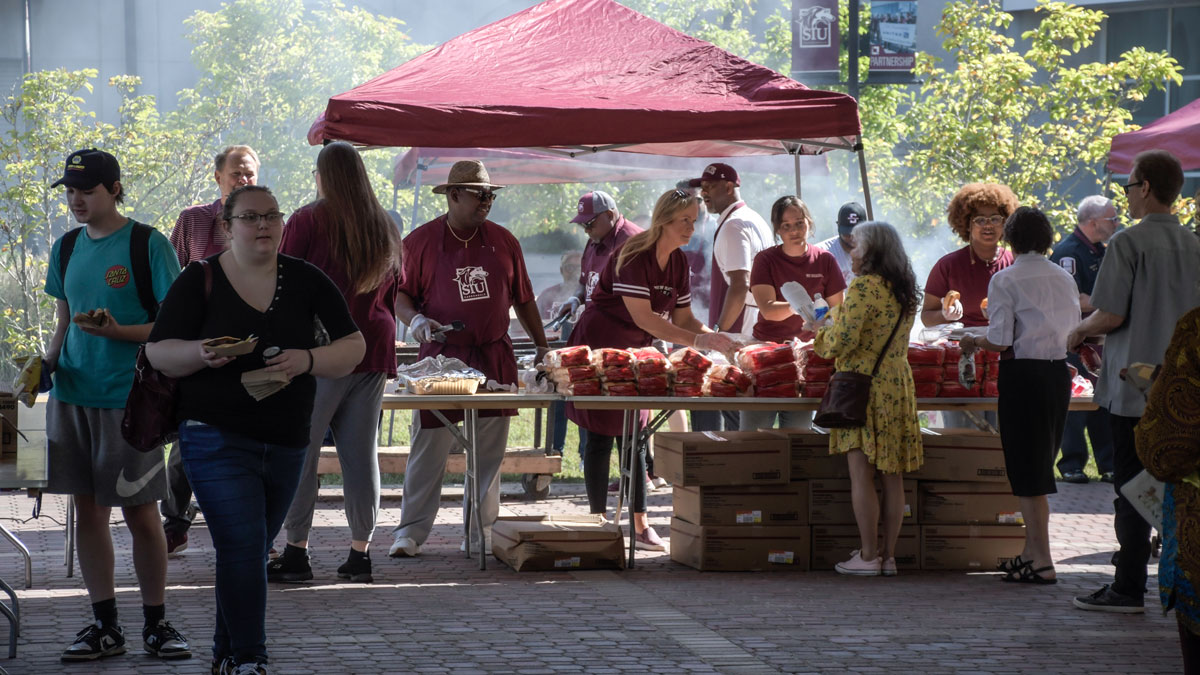 Faculty, staff and students enjoy a campus cookout.