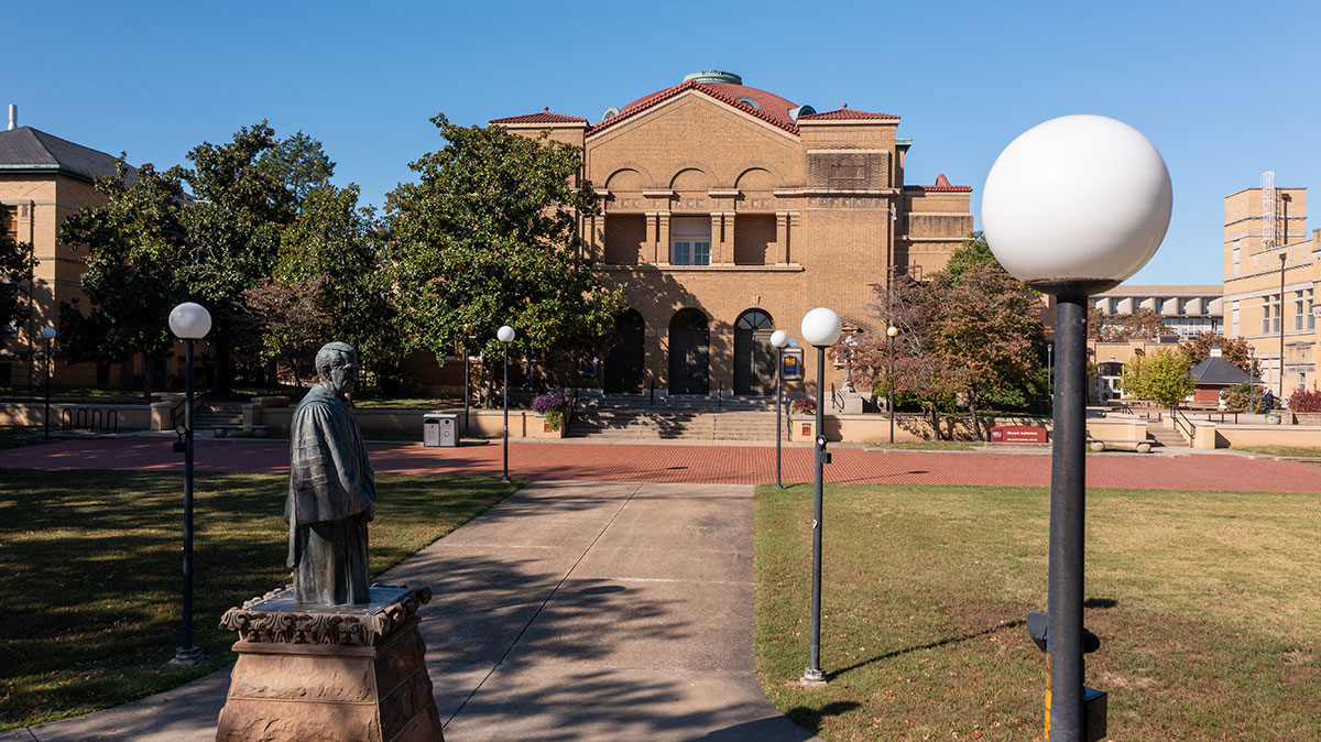 Shryock Auditorium with a statue of Delyte Morris in the foreground.